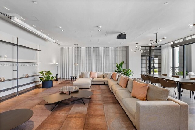 living room featuring a notable chandelier