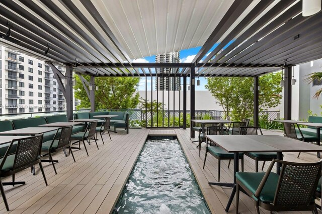 wooden terrace with a pergola