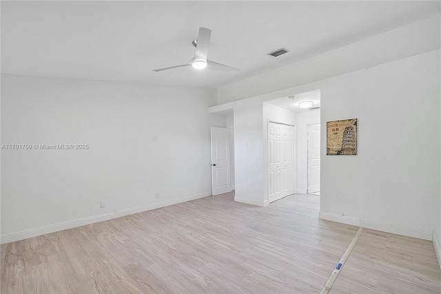 unfurnished room with light hardwood / wood-style flooring and ceiling fan