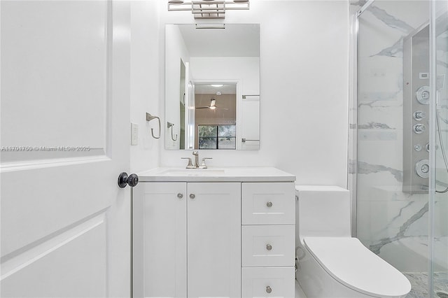 bathroom featuring vanity, an enclosed shower, and toilet