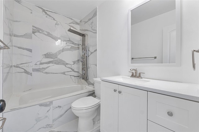 full bathroom with vanity, tiled shower / bath combo, and toilet