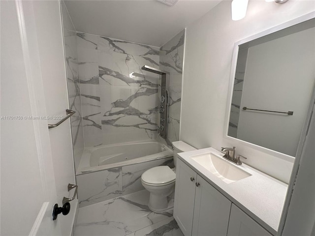 full bathroom with vanity, tiled shower / bath combo, and toilet