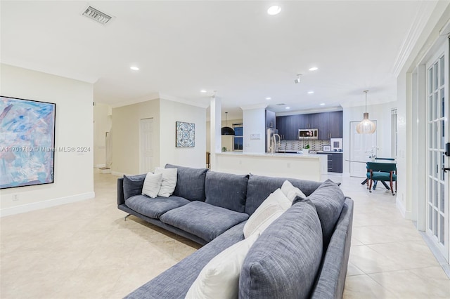 tiled living room with crown molding