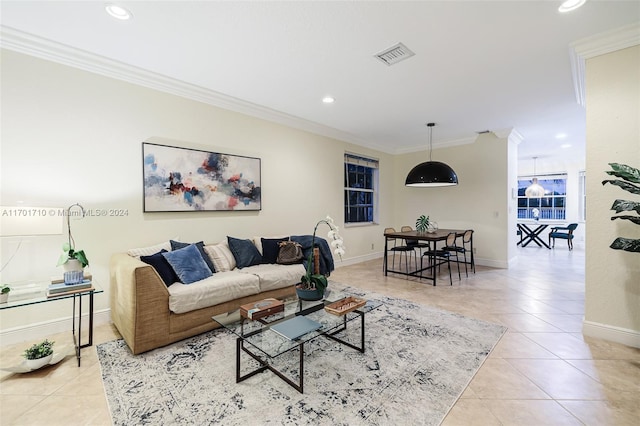 living room featuring light tile patterned floors and ornamental molding