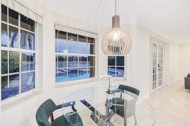 tiled dining area featuring french doors