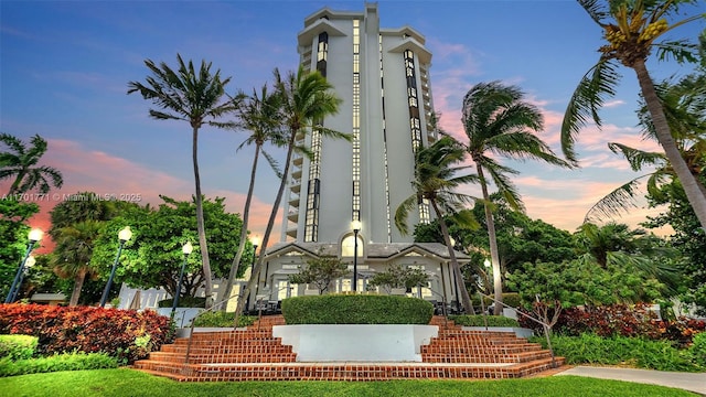 view of outdoor building at dusk