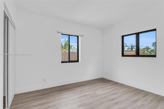 spare room featuring light hardwood / wood-style flooring