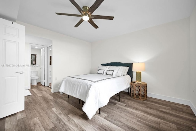 bedroom with hardwood / wood-style flooring, ensuite bath, and ceiling fan