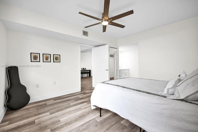 bedroom featuring hardwood / wood-style flooring and ceiling fan