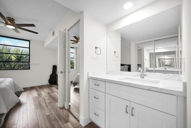 bathroom featuring vanity, hardwood / wood-style flooring, and ceiling fan