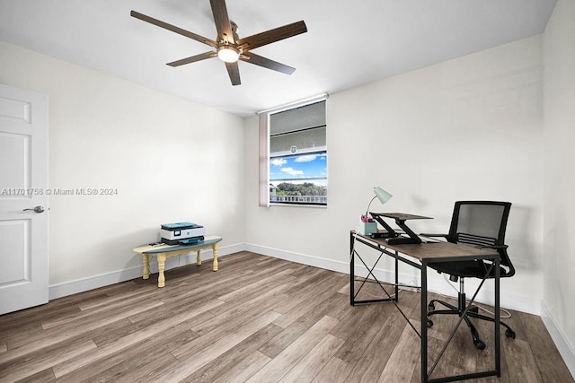 office space with ceiling fan and hardwood / wood-style floors