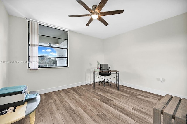 interior space with light hardwood / wood-style flooring and ceiling fan