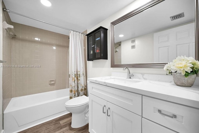 full bathroom featuring wood-type flooring, vanity, toilet, and shower / bath combo