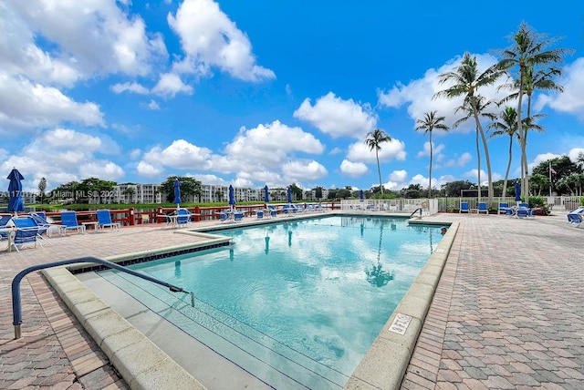 view of swimming pool featuring a patio area