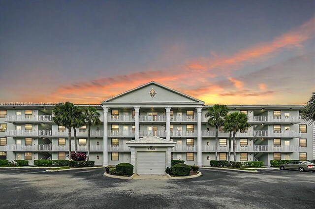 view of outdoor building at dusk