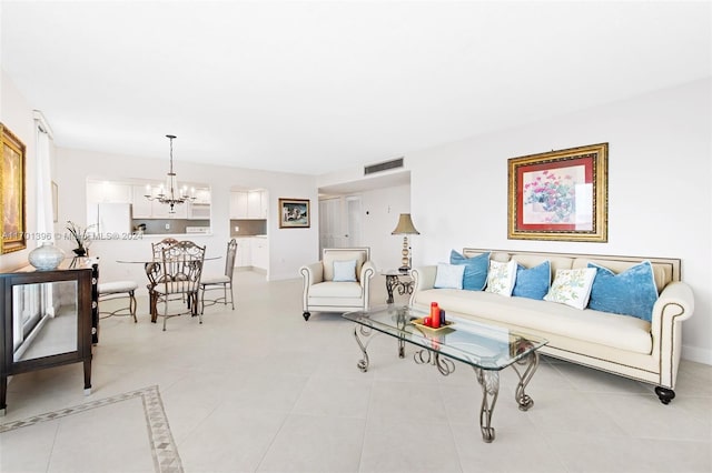 tiled living room with an inviting chandelier