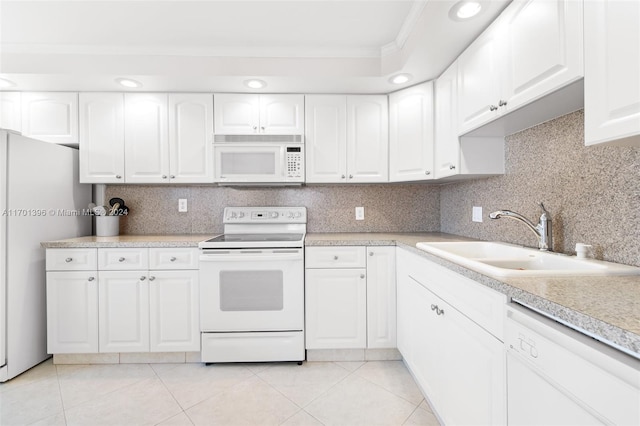 kitchen featuring white cabinets, white appliances, sink, and ornamental molding