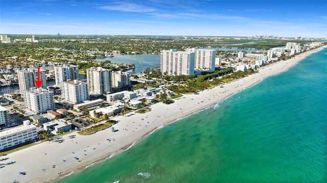 aerial view featuring a view of the beach and a water view