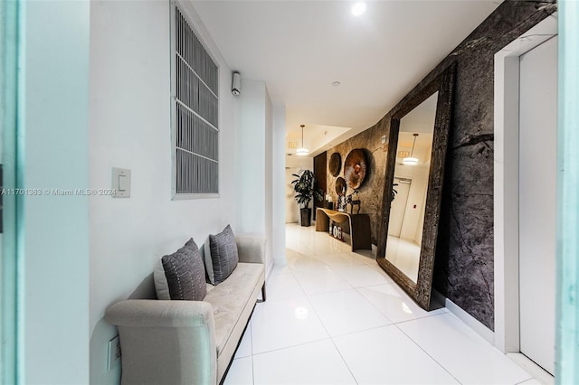 hallway featuring light tile patterned floors