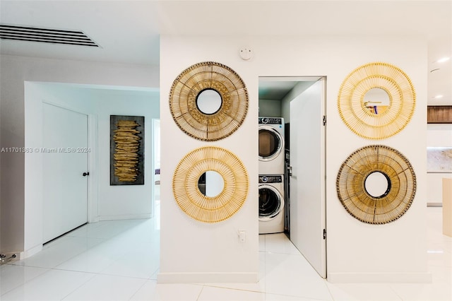 room details with stacked washer / drying machine