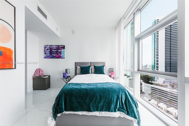 bedroom featuring light tile patterned floors