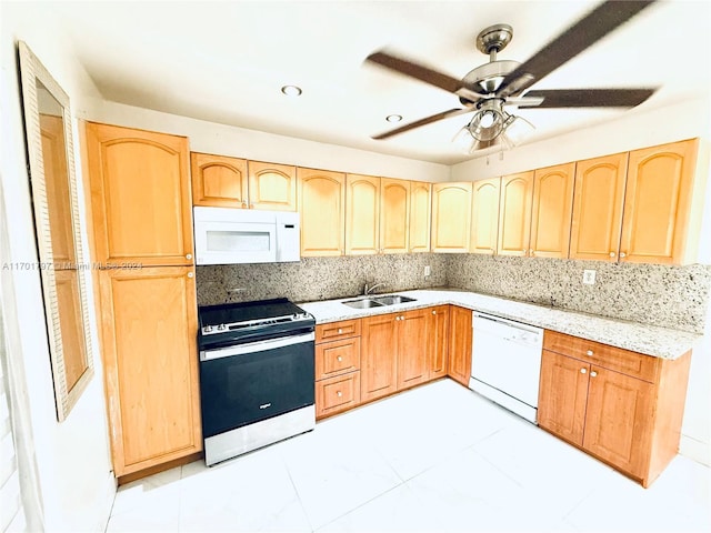 kitchen featuring light brown cabinets, white appliances, sink, decorative backsplash, and ceiling fan