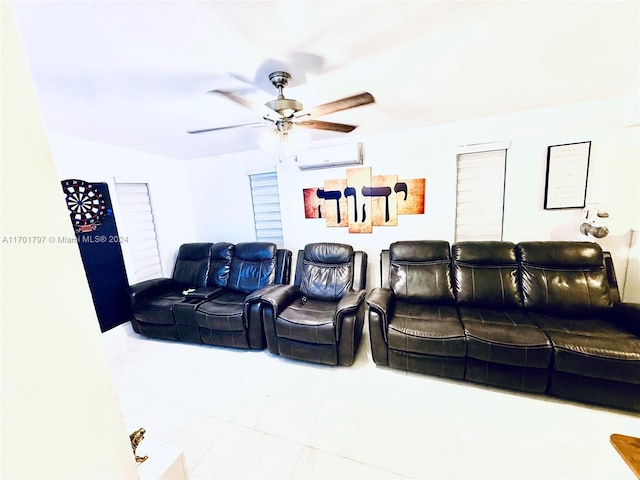 home theater room with tile patterned flooring, a wall mounted AC, and ceiling fan