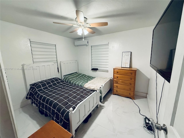 bedroom with a wall unit AC and ceiling fan