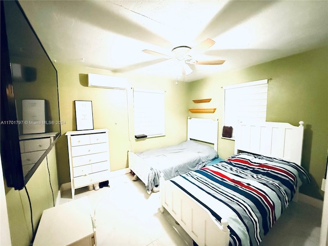 bedroom featuring ceiling fan and a wall mounted AC