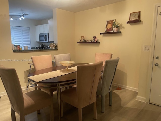 dining space featuring light hardwood / wood-style flooring