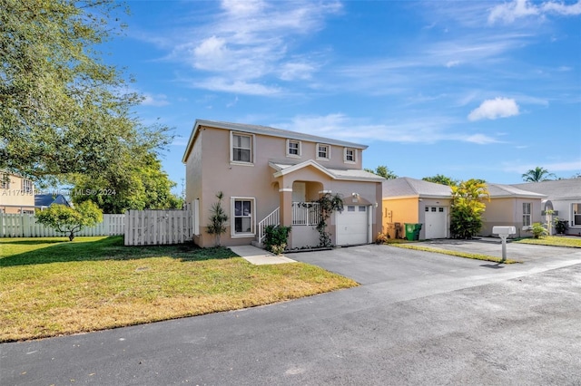 view of property with a front yard and a garage