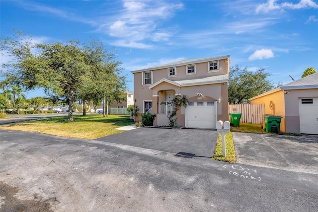 view of front property featuring a front yard and a garage