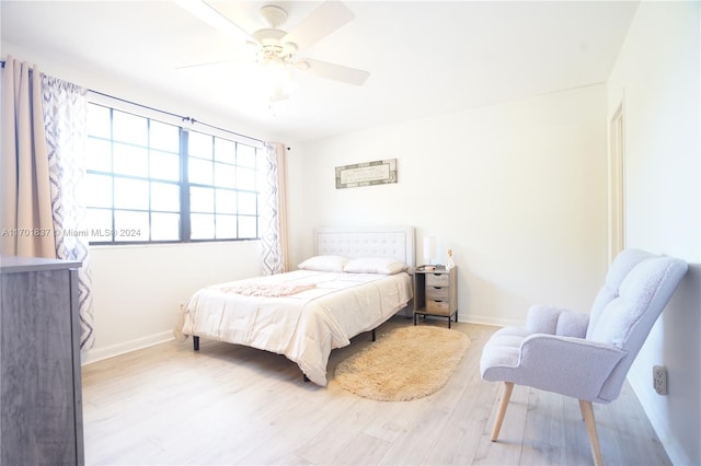 bedroom with ceiling fan and light wood-type flooring