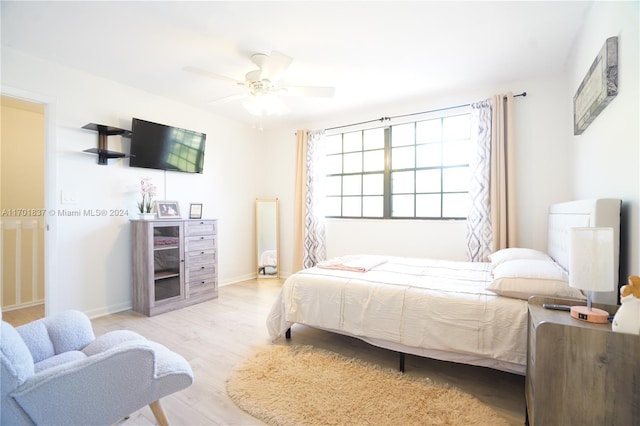 bedroom featuring ceiling fan and light hardwood / wood-style floors