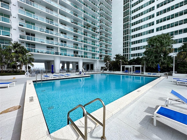 view of swimming pool featuring a patio area