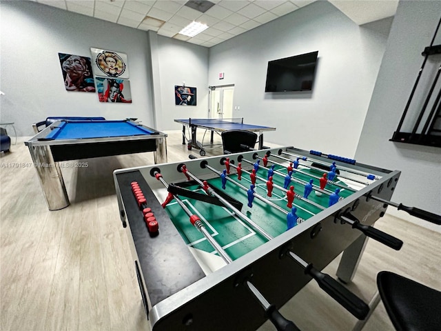 playroom with billiards, light hardwood / wood-style flooring, and a drop ceiling