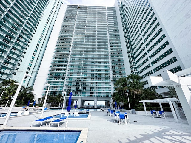 view of swimming pool with a pergola
