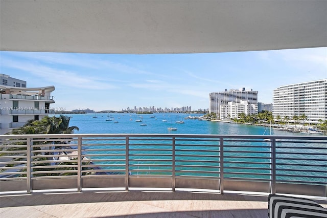 balcony featuring a water view