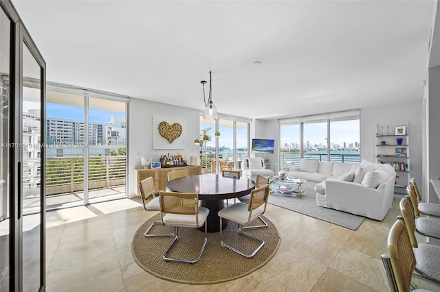 1445 16th St Unit 602, Miami Beach, FL 33139 - dining space with floor to ceiling windows and light tile patterned flooring
