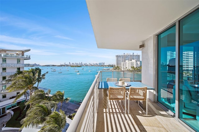 balcony featuring a water view