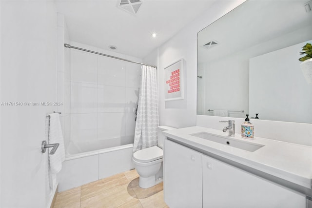 full bathroom featuring tile patterned floors, vanity, toilet, and shower / bathtub combination with curtain