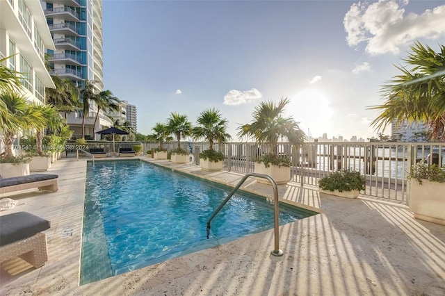 view of swimming pool with a patio area