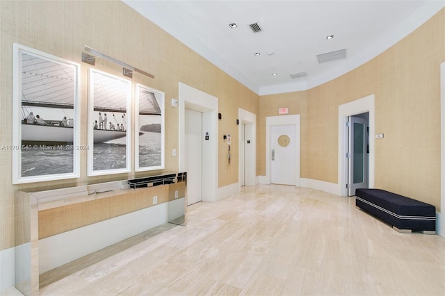 interior space featuring light hardwood / wood-style floors and elevator