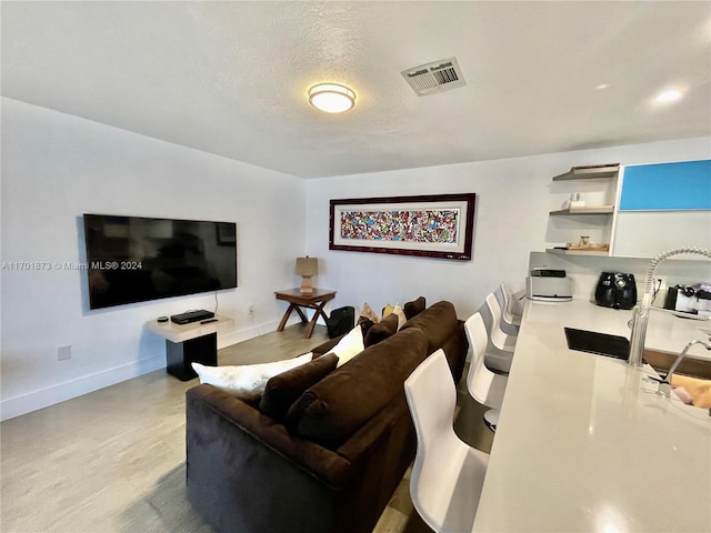 living room featuring a textured ceiling