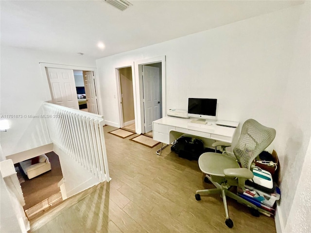 home office featuring light hardwood / wood-style floors