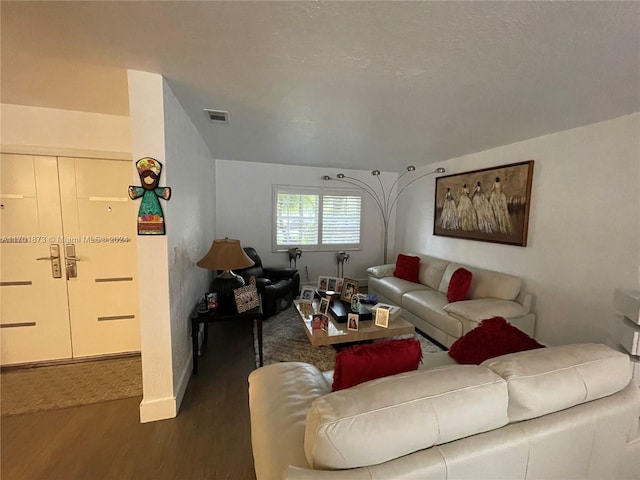 living room with dark hardwood / wood-style floors