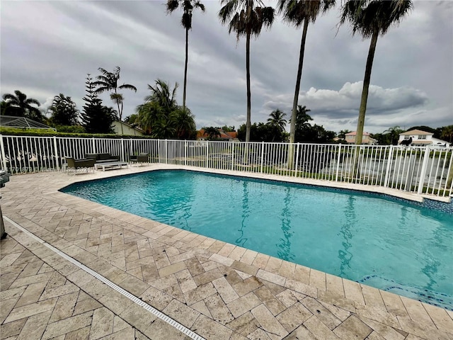 view of swimming pool with a patio