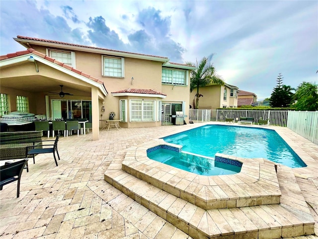 view of pool featuring an in ground hot tub, a patio, area for grilling, and ceiling fan