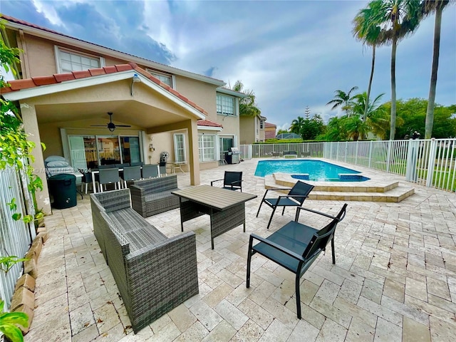 view of pool with outdoor lounge area, ceiling fan, and a patio