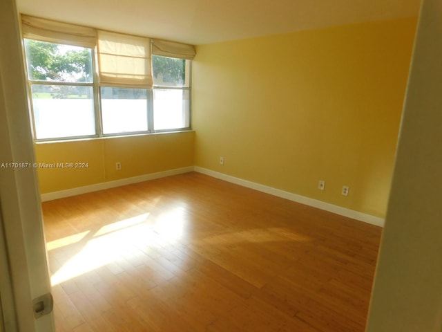 spare room with hardwood / wood-style flooring